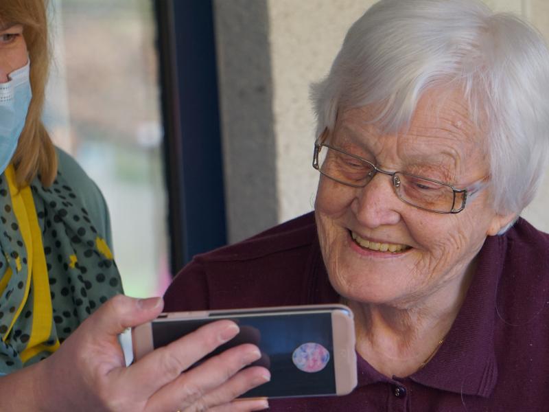 Old woman and phone