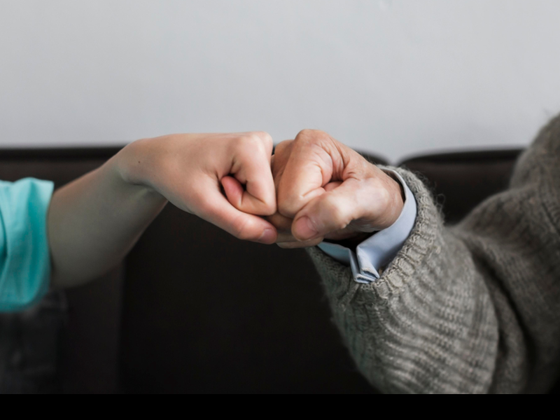 two people fistbumping