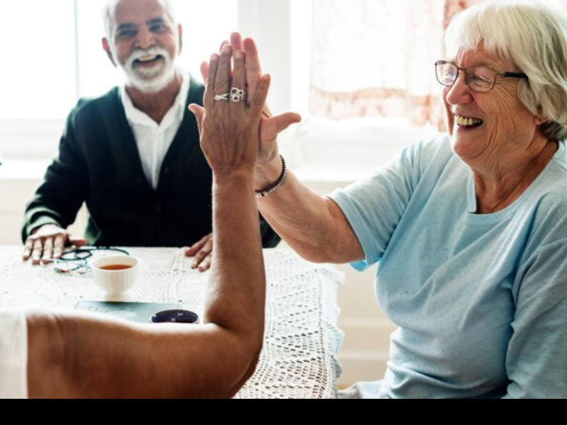 two older women high fiving