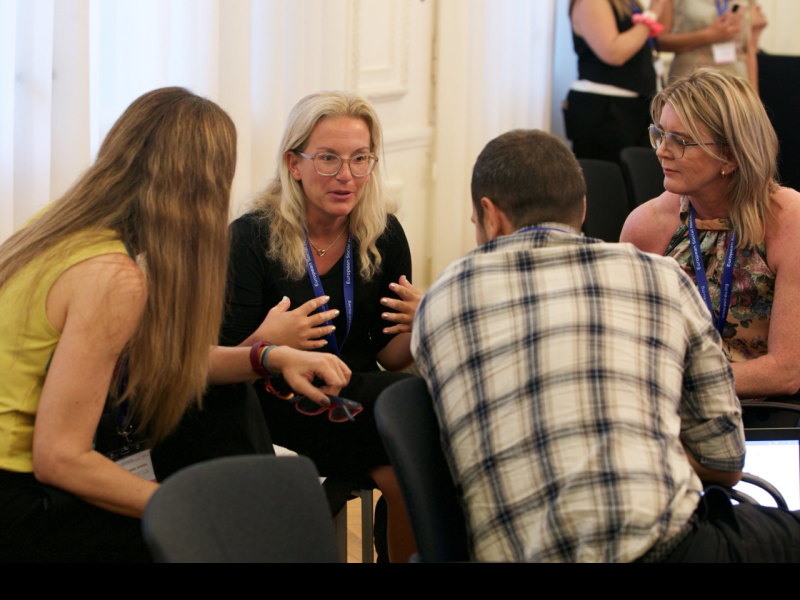 Participants at an ESN event talking intensely